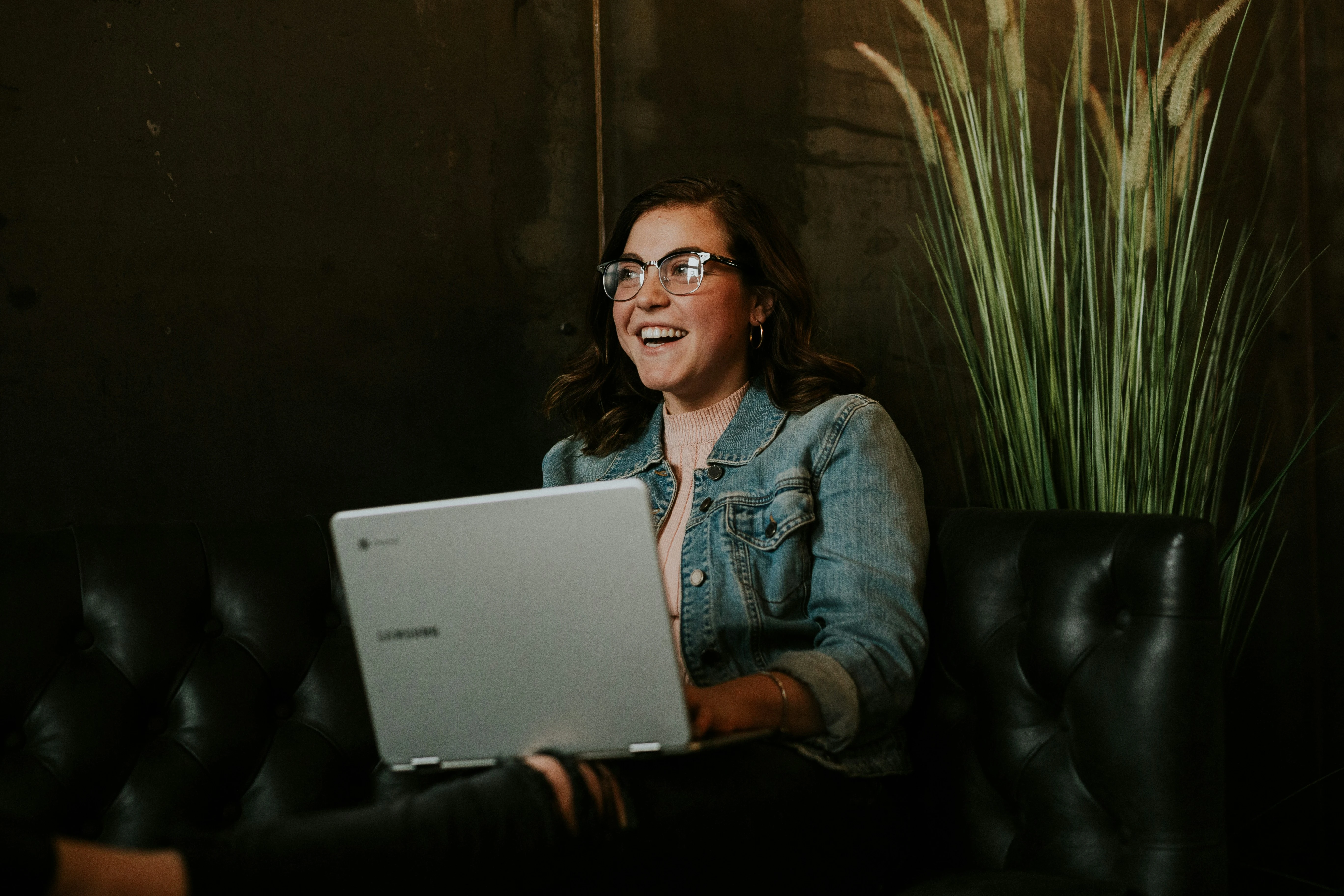 Happy person using their laptop